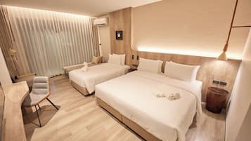 Family Triple Room | In-room safe, desk, laptop workspace, blackout curtains