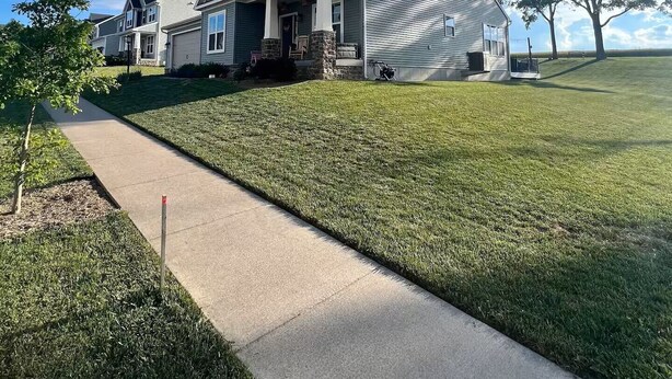 A residential area with a house featuring a stone foundation, a front porch, and a well-maintained lawn. - Tranquil 4-bedroom in charming Boalsburg, close to Beaver Stadium (Boalsburg)