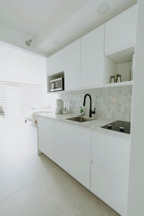 Fridge, microwave, stovetop, coffee/tea maker