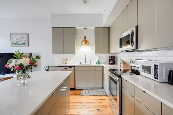 Fridge, coffee/tea maker, cookware/dishes/utensils