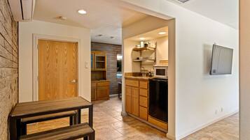 Fridge, microwave, coffee/tea maker, cookware/dishes/utensils