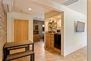 Fridge, microwave, coffee/tea maker, cookware/dishes/utensils