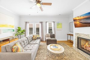 TV, fireplace, books
