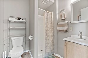 Shower, hair dryer, towels