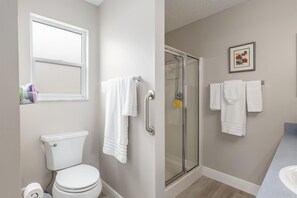 Shower, hair dryer, towels, soap