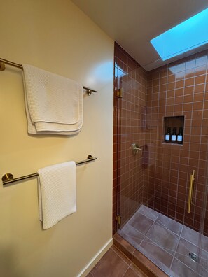 Shower, hair dryer, towels, toilet paper