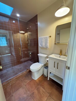 Shower, hair dryer, towels, toilet paper