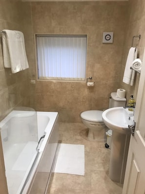 Deluxe Double Room | Bathroom | Combined shower/tub, hair dryer, towels, soap
