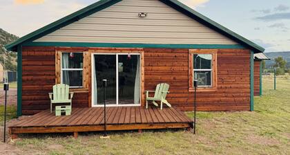 Ride the trails, reel in the fun, relax in the mountains at this Cozy Cabin