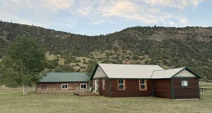 Ride the trails, reel in the fun, relax in the mountains at this Cozy Cabin