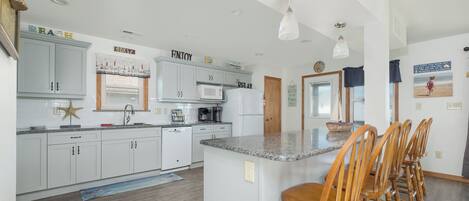 Coffee/tea maker, fridge, microwave, oven