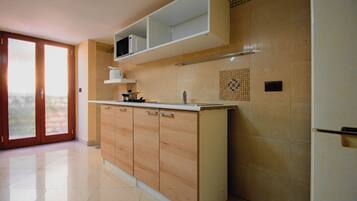 Fridge, microwave, stovetop, coffee/tea maker
