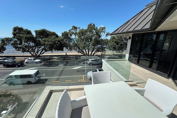 Directly opposite the beach close to Auckland city