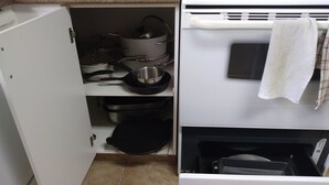 A kitchen with a white oven, a built-in microwave, and a dishwasher.