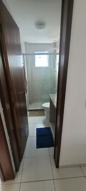 Shower, hair dryer, towels, toilet paper