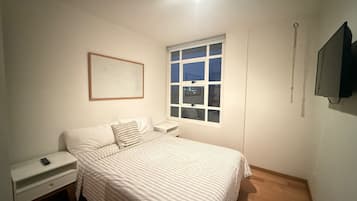 Family Apartment, City View | In-room safe, desk, laptop workspace, blackout curtains