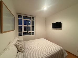 Family Apartment, City View | In-room safe, desk, laptop workspace, blackout curtains