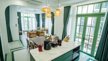 Deluxe Villa, 6 Bedrooms, Balcony, Garden View | Living area | 60-inch LED TV with cable channels, streaming services