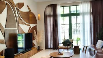 Deluxe Villa, 6 Bedrooms, Balcony, Garden View | Living area | 60-inch LED TV with cable channels, streaming services