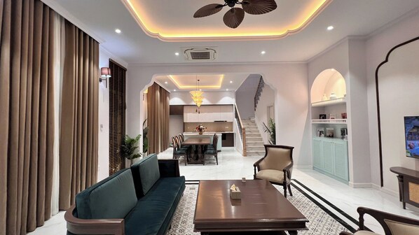 Deluxe Villa, 4 Bedrooms, Balcony, Garden View | Living area | 60-inch LED TV with cable channels, streaming services