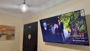 Comfort Apartment, 2 Bedrooms | Living area | 55-cm Smart TV with digital channels