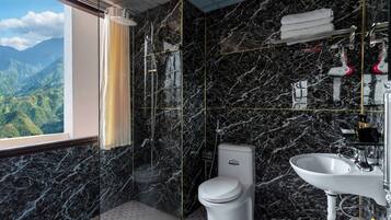 Deluxe Triple Room | Bathroom | Shower, slippers, towels, soap