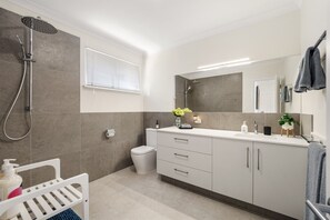 Shower, towels, soap, toilet paper