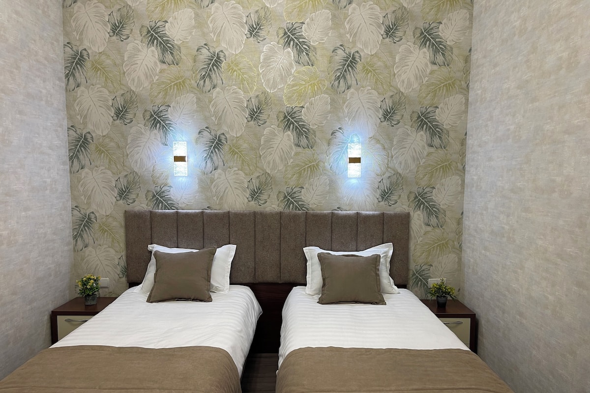 Deluxe Triple Room, Garden View | In-room safe, laptop workspace, blackout drapes, free WiFi