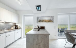 Fridge, stovetop, dishwasher, coffee/tea maker