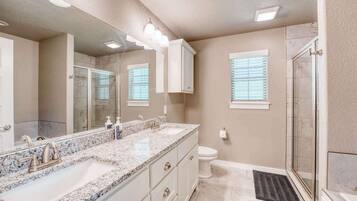 Shower, hair dryer, towels, shampoo