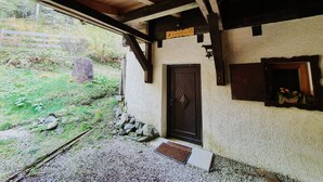A rustic wooden structure with a door and a small window. - Idyllic Cabin With Sauna (Bad Kleinkirchheim)