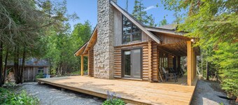 Disconnect from it all at Stonewood, a cozy log chalet nestled in cedar forest on Georgian Bay. Enjoy a private shoreline, wraparound deck, wood stove, and access to kayaks, and trails. Peace, comfort, and adventure await in Cape Chin South.