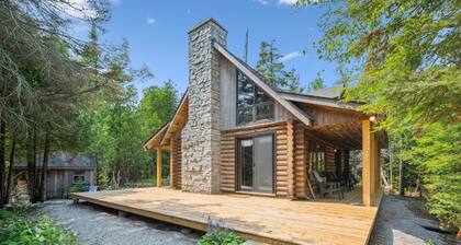 Disconnect from it all at Stonewood, a cozy log chalet nestled in cedar forest on Georgian Bay. Enjoy a private shoreline, wraparound deck, wood stove, and access to kayaks, and trails. Peace, comfort, and adventure await in Cape Chin South.