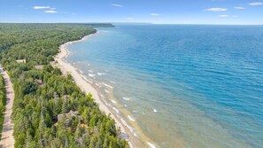 Beach - Disconnect from it all at Stonewood, a cozy log chalet nestled in cedar forest on Georgian Bay. Enjoy a private shoreline, wraparound deck, wood stove, and access to kayaks, and trails. Peace, comfort, and adventure await in Cape Chin South. (Lions Head)