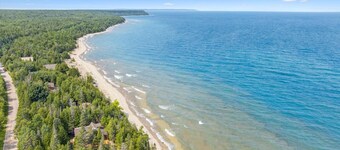 Disconnect from it all at Stonewood, a cozy log chalet nestled in cedar forest on Georgian Bay. Enjoy a private shoreline, wraparound deck, wood stove, and access to kayaks, and trails. Peace, comfort, and adventure await in Cape Chin South.