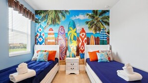 A room with two beds, a mural of surfboards, and a window with blinds. - Lakeview! Big Screen! Resort 6 mi 2 Disney! 2576 (Kissimmee)
