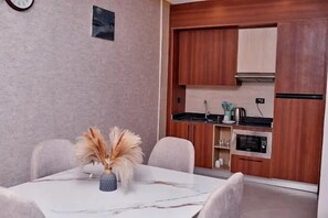 Family Apartment, Balcony, City View | Dining room