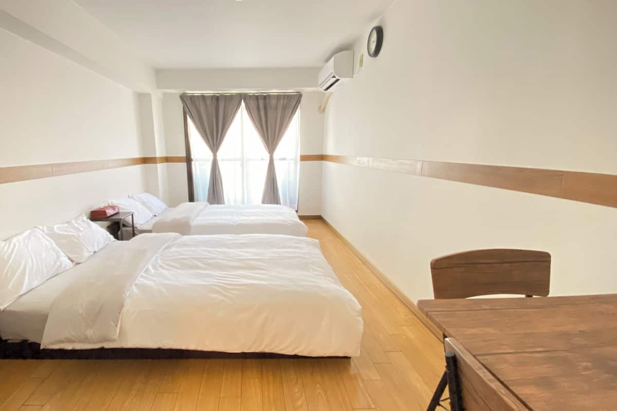 Desk, laptop workspace, free WiFi, bed sheets