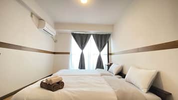 Desk, laptop workspace, free WiFi, bed sheets