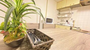 City Apartment, 2 Bedrooms, Refrigerator & Microwave, City View | Living area | 32-inch flat-screen TV with digital channels