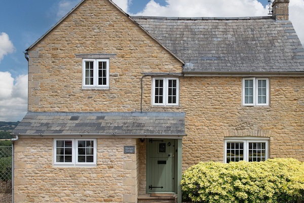 The property is built in the Cotswold stone typical of the area