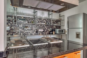 Fridge, microwave, stovetop, coffee/tea maker