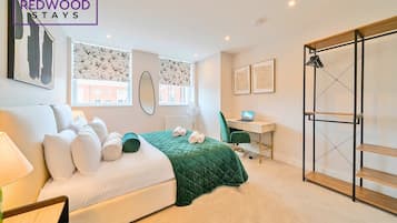 1 bedroom, desk, iron/ironing board, travel crib