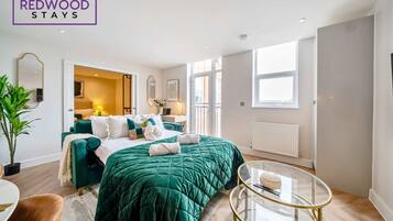 1 bedroom, desk, iron/ironing board, travel crib