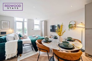 1 bedroom, desk, iron/ironing board, travel crib