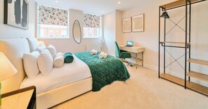 1 bedroom, desk, iron/ironing board, travel crib