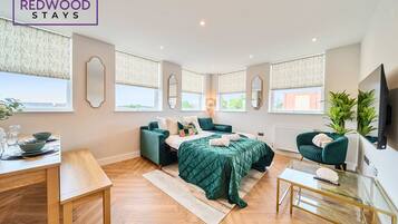 1 bedroom, desk, iron/ironing board, travel crib