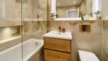 Shower, hair dryer, towels, shampoo
