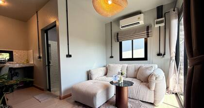 You will Enjoy a Stylish Stay with 4K Curved Monitor, Cozy Couch & Central Spot