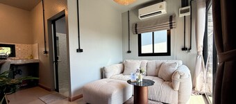 You will Enjoy a Stylish Stay with 4K Curved Monitor, Cozy Couch & Central Spot